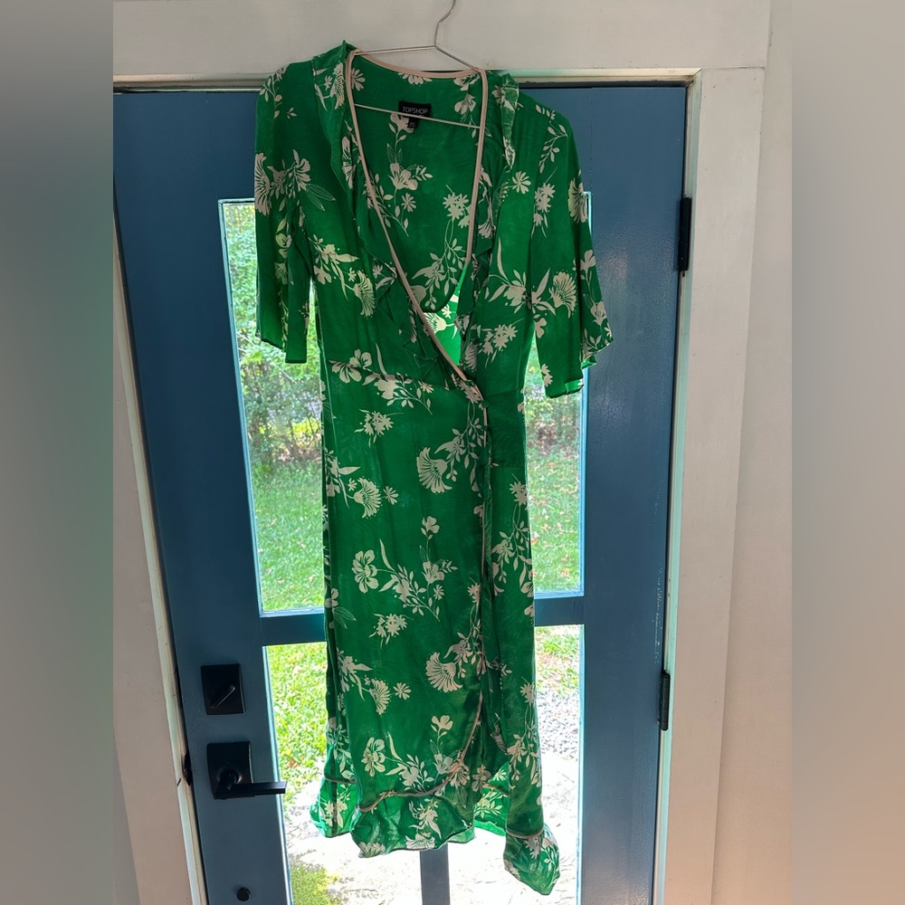 Kelly green wrap dress with white rose accents